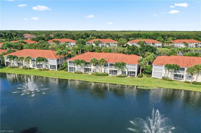 an aerial view of residential houses and outdoor space