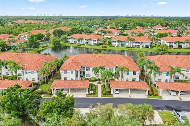 an aerial view of city and lake