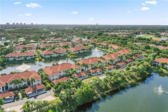 an aerial view of river residential houses with outdoor space and lake view