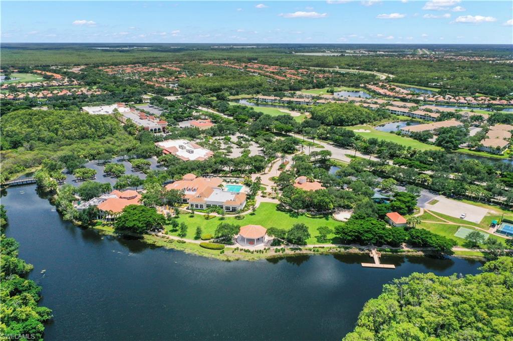 23741 Old Port Road, Unit 204 Estero, FL 34135 - Photo 42 of 46 an aerial view of residential houses with outdoor space and swimming pool