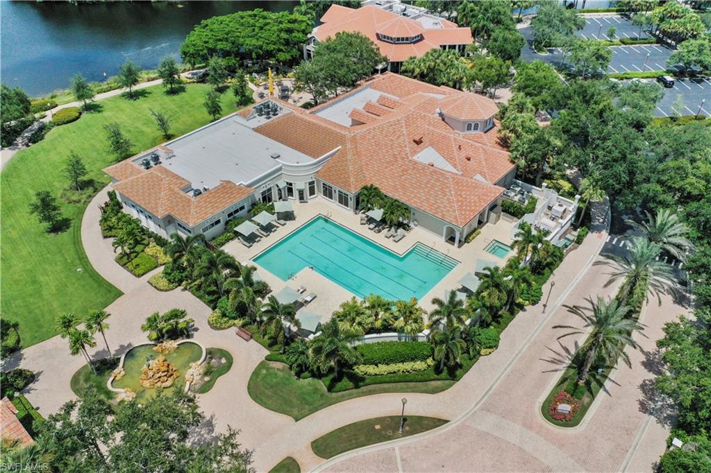 23741 Old Port Road, Unit 204 Estero, FL 34135 - Photo 45 of 46 an aerial view of a house with a garden and lake view