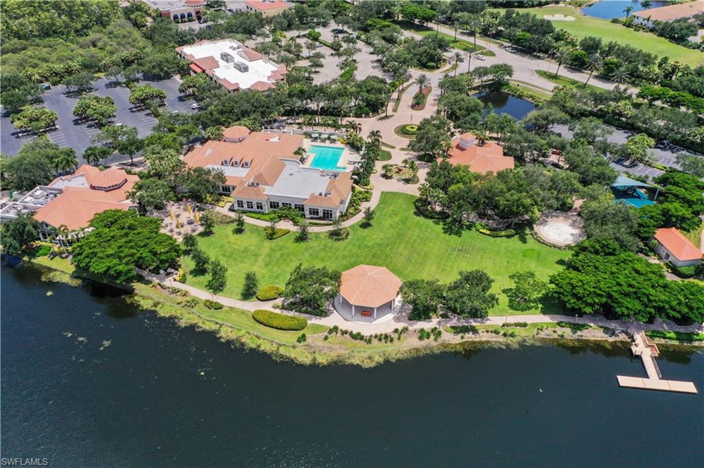 23741 Old Port Road, Unit 204 Estero, FL 34135 - Photo 46 of 46 an aerial view of a house with a garden and lake view