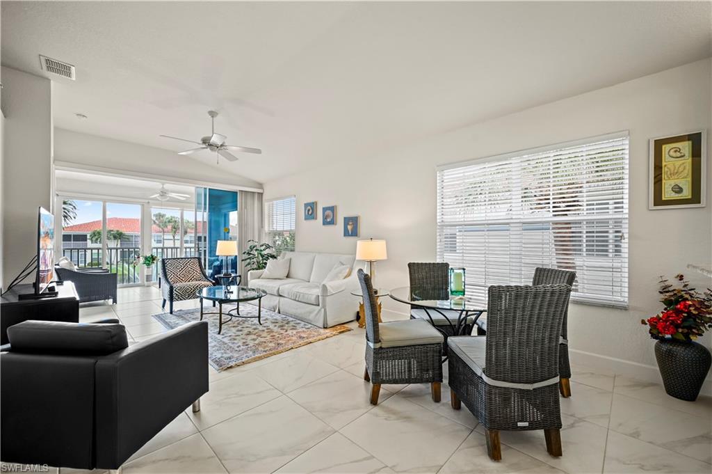 23741 Old Port Road, Unit 204 Estero, FL 34135 - Photo 6 of 46 a living room with furniture and a potted plants