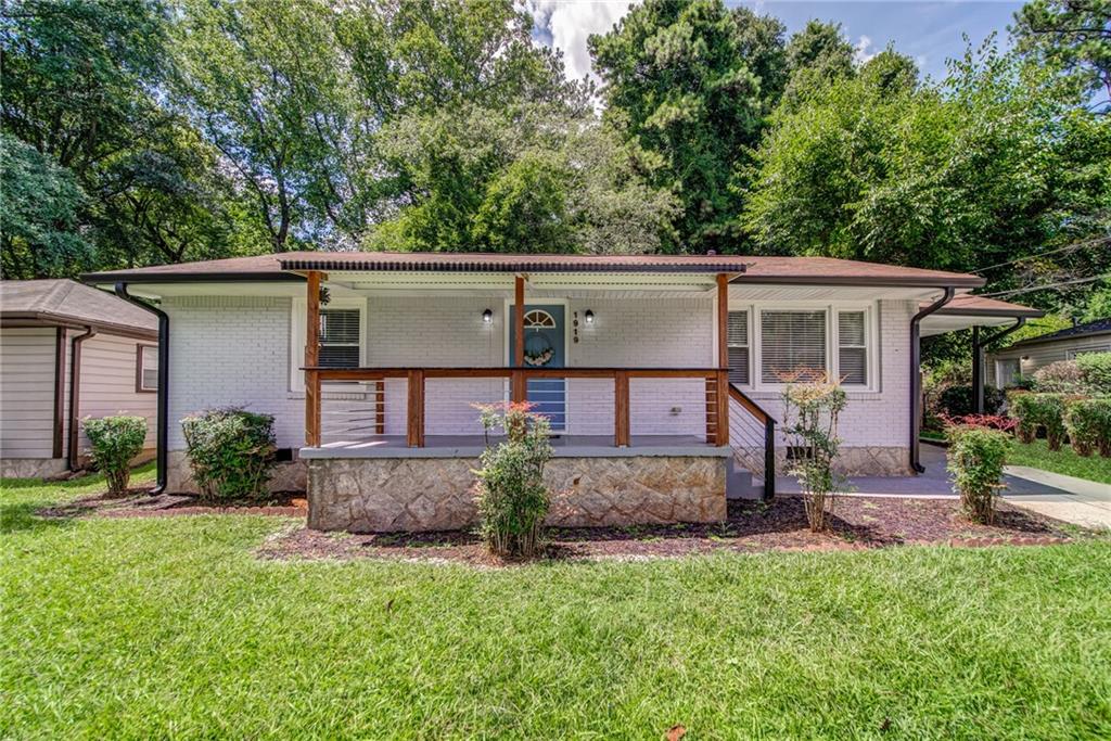 1919 Meadow Lane Decatur, GA 30032 - Photo 1 of 1 front view of a house with a yard