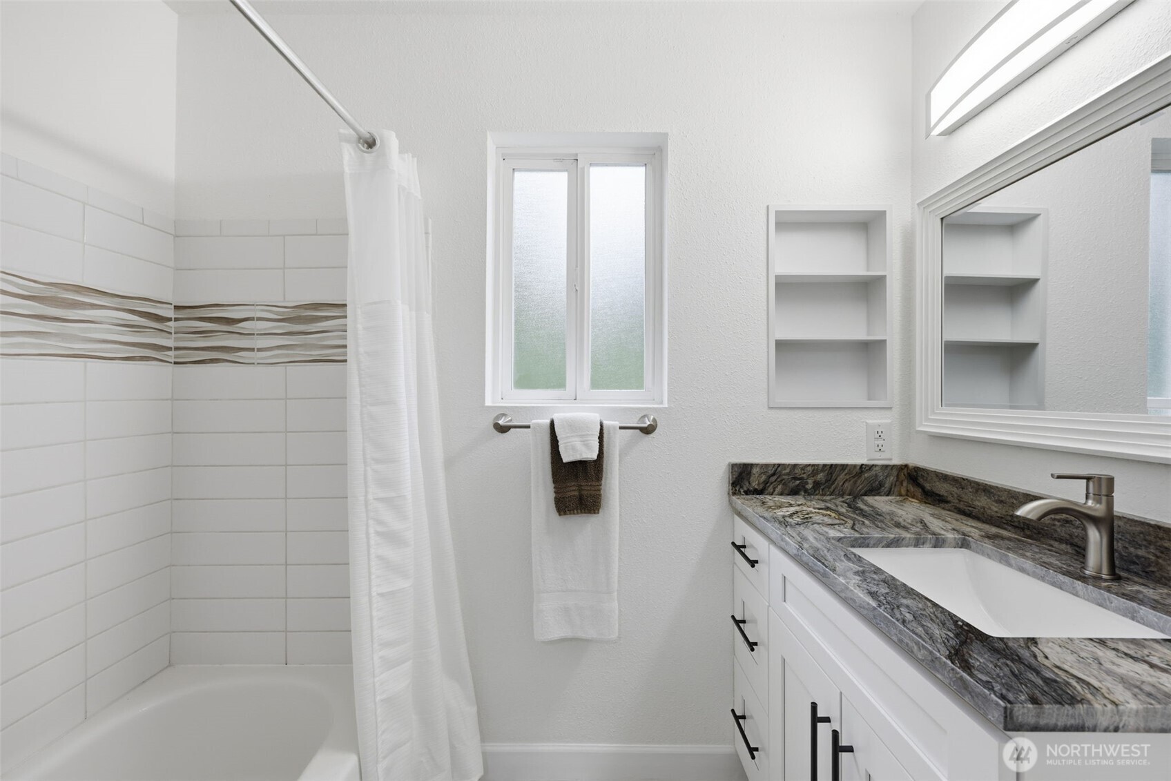 26224 14th Place South Des Moines, WA 98198 - Photo 15 of 37 a bathroom with a granite countertop sink a bathtub and shower