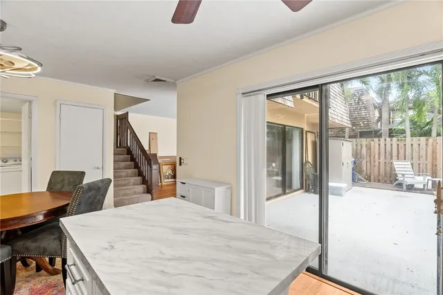 a bedroom with furniture and a large window