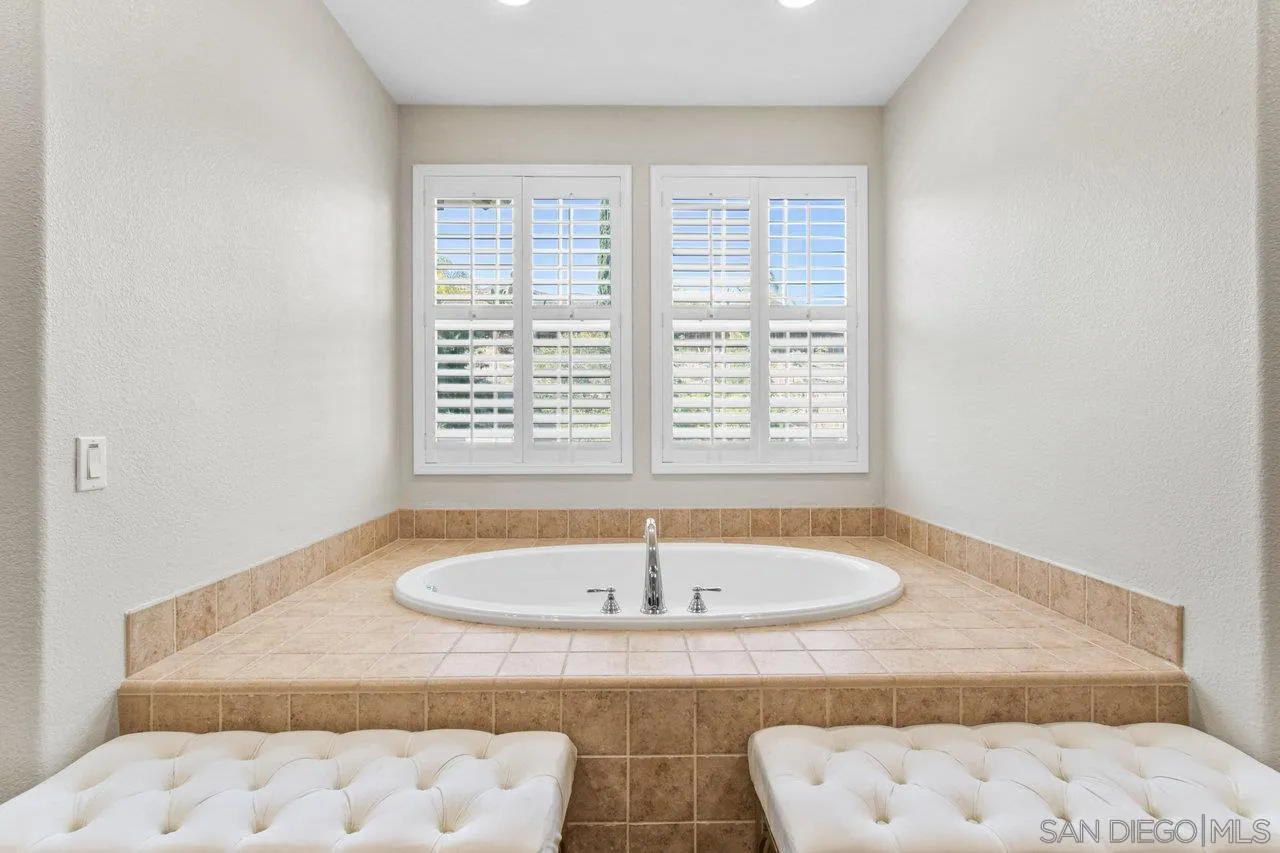 2957 Ranch Gate Road Chula Vista, CA 91914 - Photo 40 of 75 a bath tub sitting in a bathroom next to a window