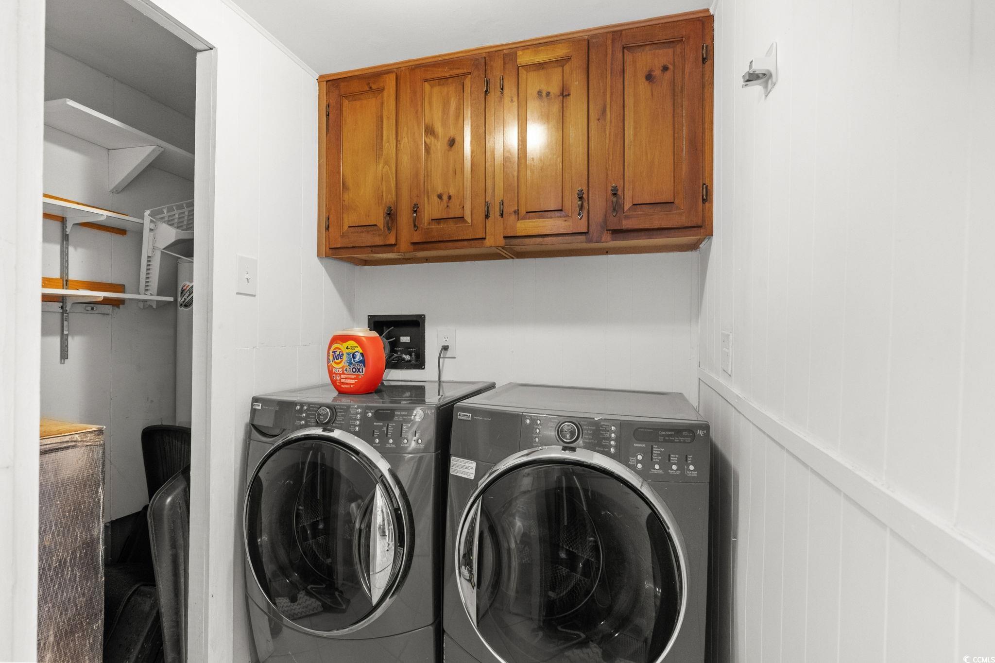 125 Moultrie Court Murrells Inlet, SC 29576 - Photo 24 of 40 Laundry room featuring washer and clothes dryer and cabinet space