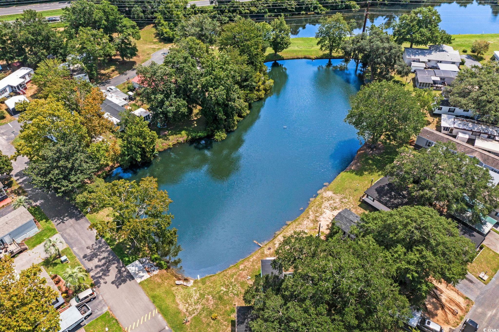 125 Moultrie Court Murrells Inlet, SC 29576 - Photo 34 of 40 Drone / aerial view of a nearby body of water