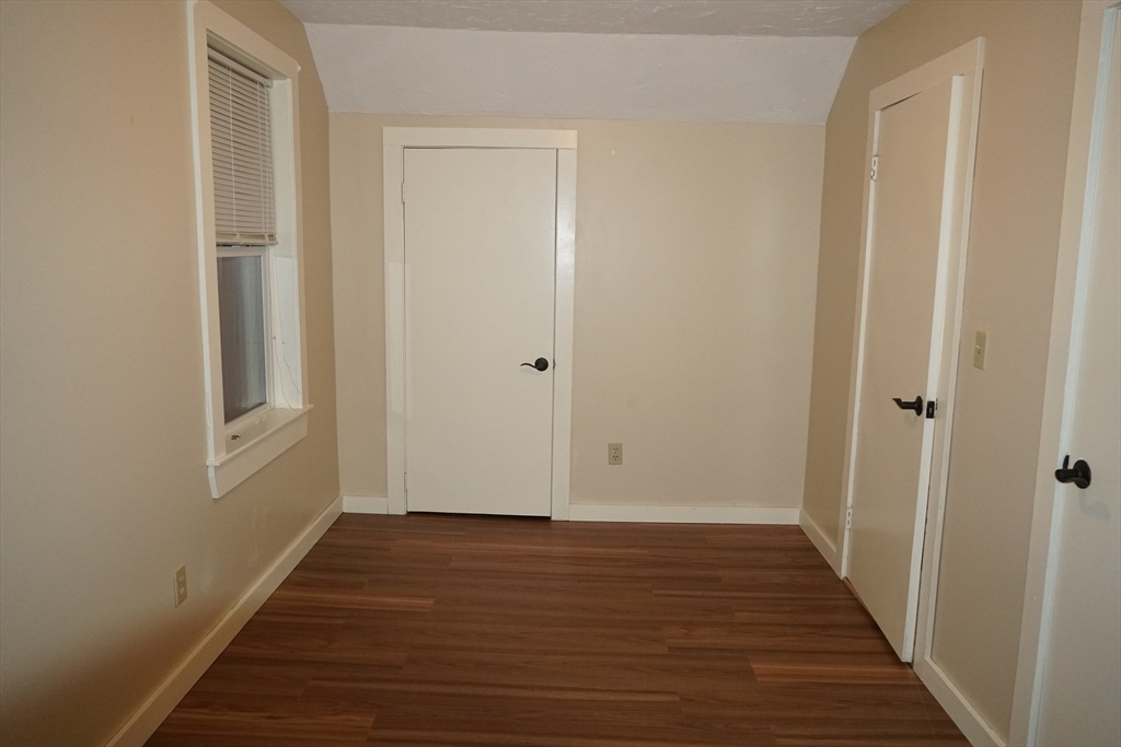 39 Burt Street, Unit 1 Berkley, MA 02779 - Photo 13 of 19 a view of a hallway with wooden floor and closet