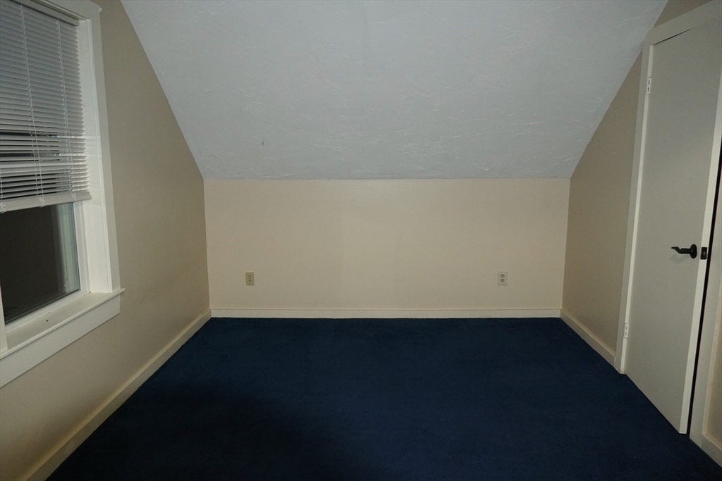 39 Burt Street, Unit 1 Berkley, MA 02779 - Photo 15 of 19 a view of an empty room with wooden floor and a window
