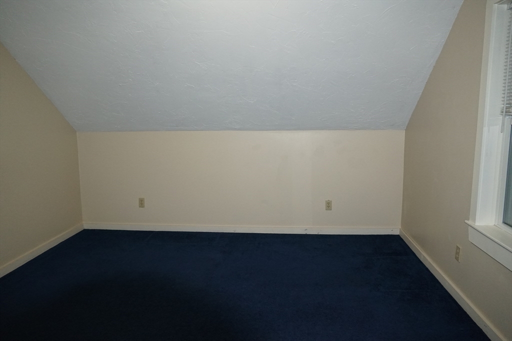 39 Burt Street, Unit 1 Berkley, MA 02779 - Photo 16 of 19 an empty room with wooden floor and windows