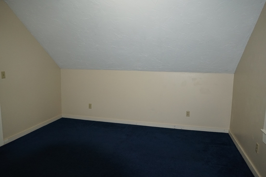 39 Burt Street, Unit 1 Berkley, MA 02779 - Photo 17 of 19 an empty room with a wooden floor and sink