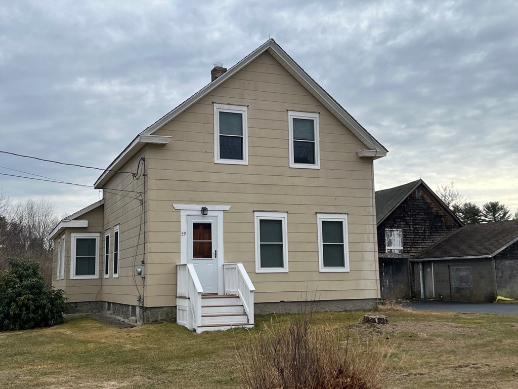 39 Burt Street, Unit 1 Berkley, MA 02779 - Photo 2 of 19 a view of a house with a yard