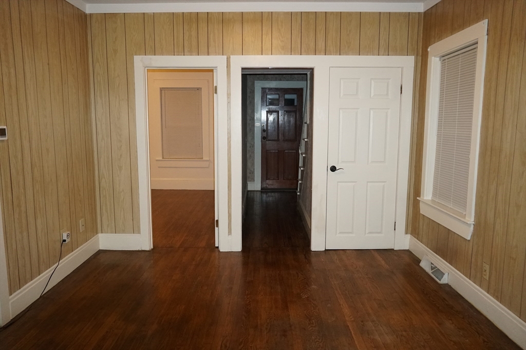 39 Burt Street, Unit 1 Berkley, MA 02779 - Photo 7 of 19 a view of a hallway with wooden floor