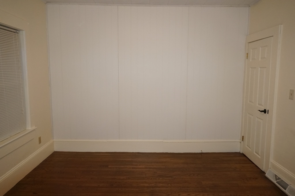39 Burt Street, Unit 1 Berkley, MA 02779 - Photo 10 of 19 a view of a small space with wooden floor and a window