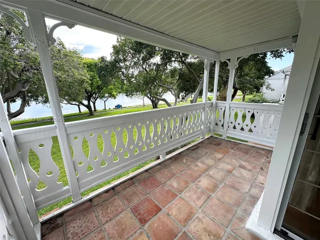 a balcony with wooden floor