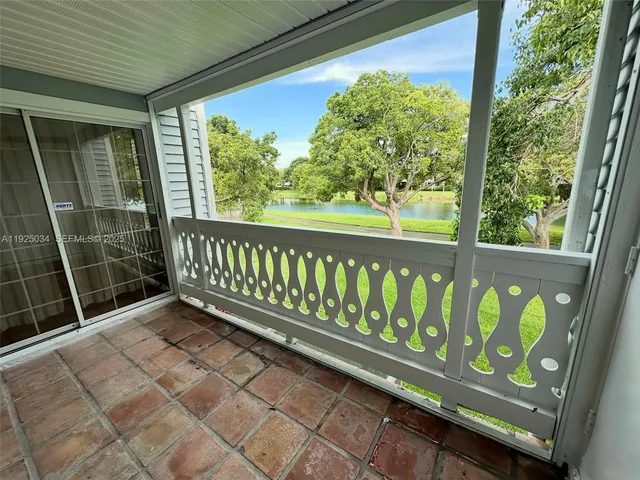 a view of porch with a bench