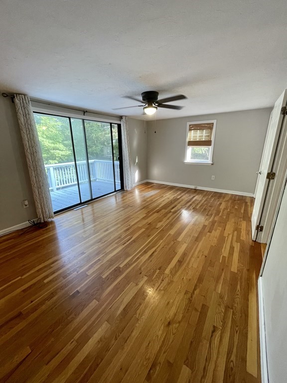 75 Moritz Road Marshfield, MA 02050 - Photo 14 of 18 a view of an empty room with a window and wooden floor