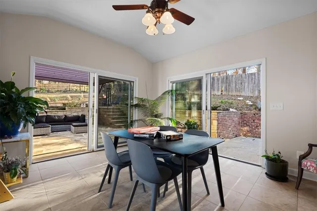 a dining room with furniture window and wooden floor