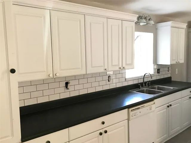a close up of a sink and a shower