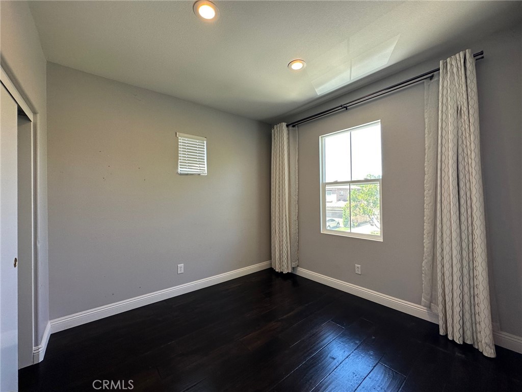 33 Sagebrush Irvine, CA 92618 - Photo 14 of 22 an empty room with wooden floor and windows