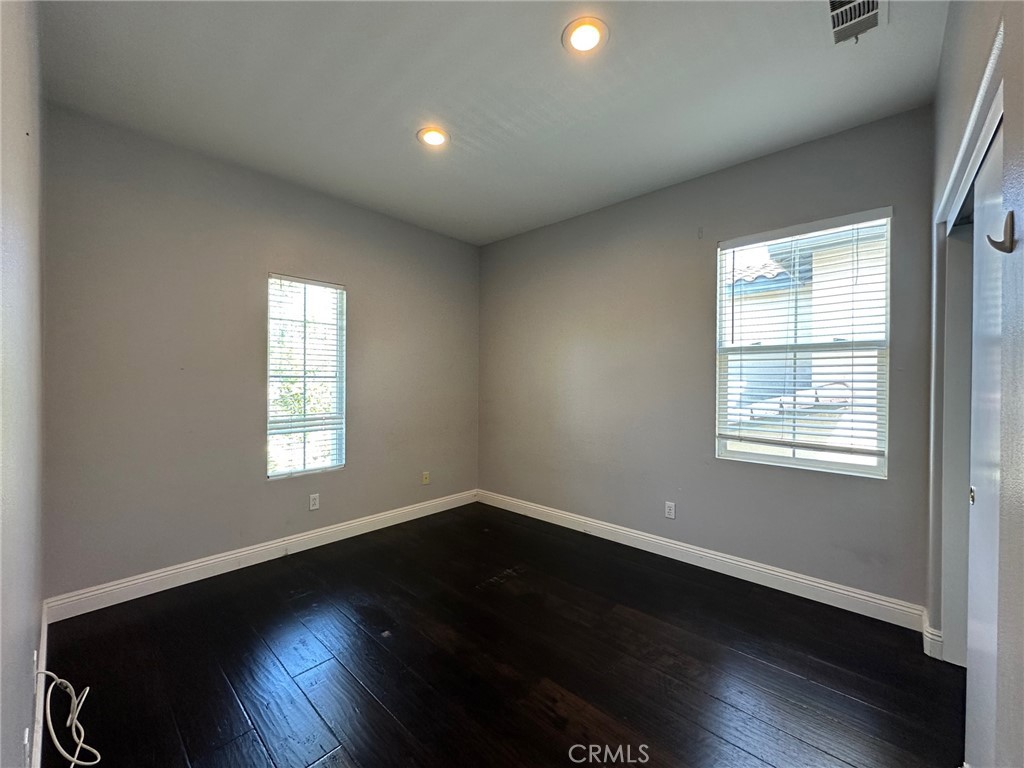 33 Sagebrush Irvine, CA 92618 - Photo 15 of 22 a view of an empty room with wooden floor and a window