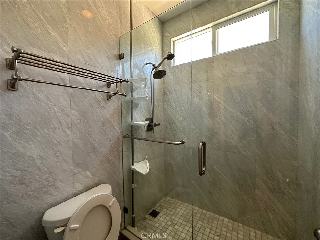 33 Sagebrush Irvine, CA 92618 - Photo 17 of 22 a bathroom with a shower a toilet and a sink