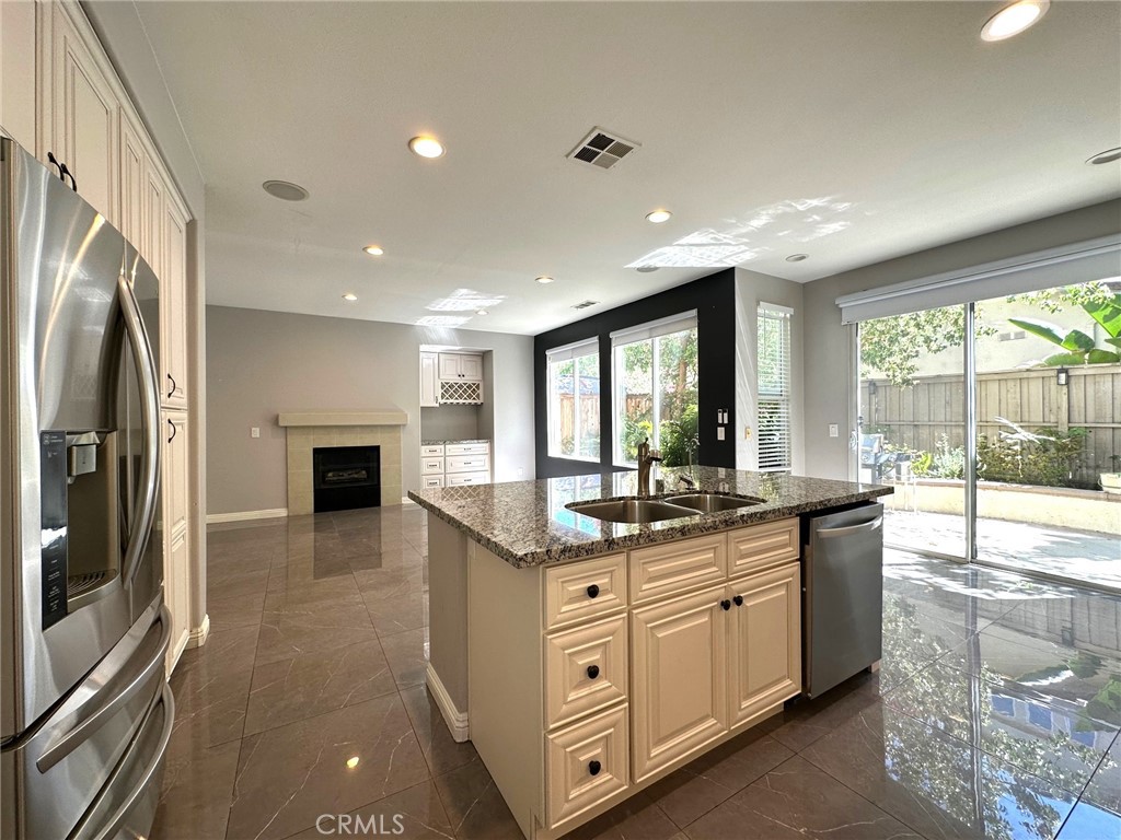 33 Sagebrush Irvine, CA 92618 - Photo 8 of 22 a kitchen with stainless steel appliances granite countertop a stove and a sink