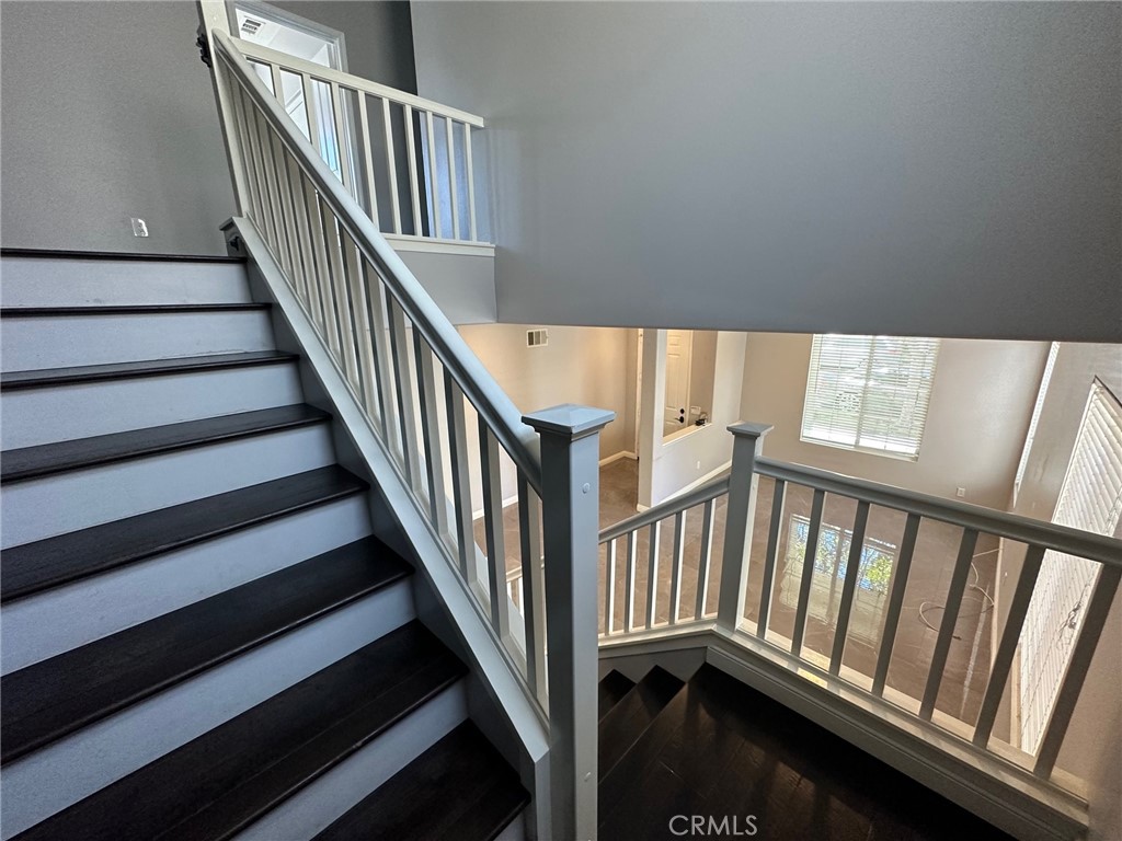 33 Sagebrush Irvine, CA 92618 - Photo 9 of 22 a view of staircase with railing and a rug