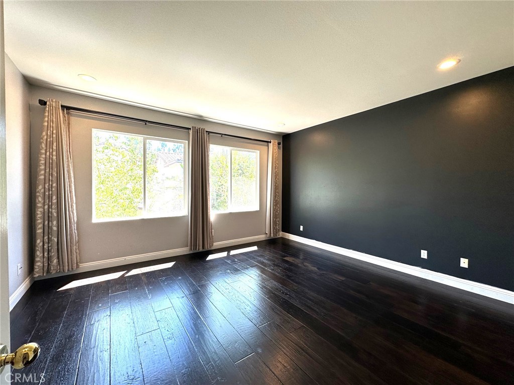 33 Sagebrush Irvine, CA 92618 - Photo 10 of 22 an empty room with wooden floor and windows