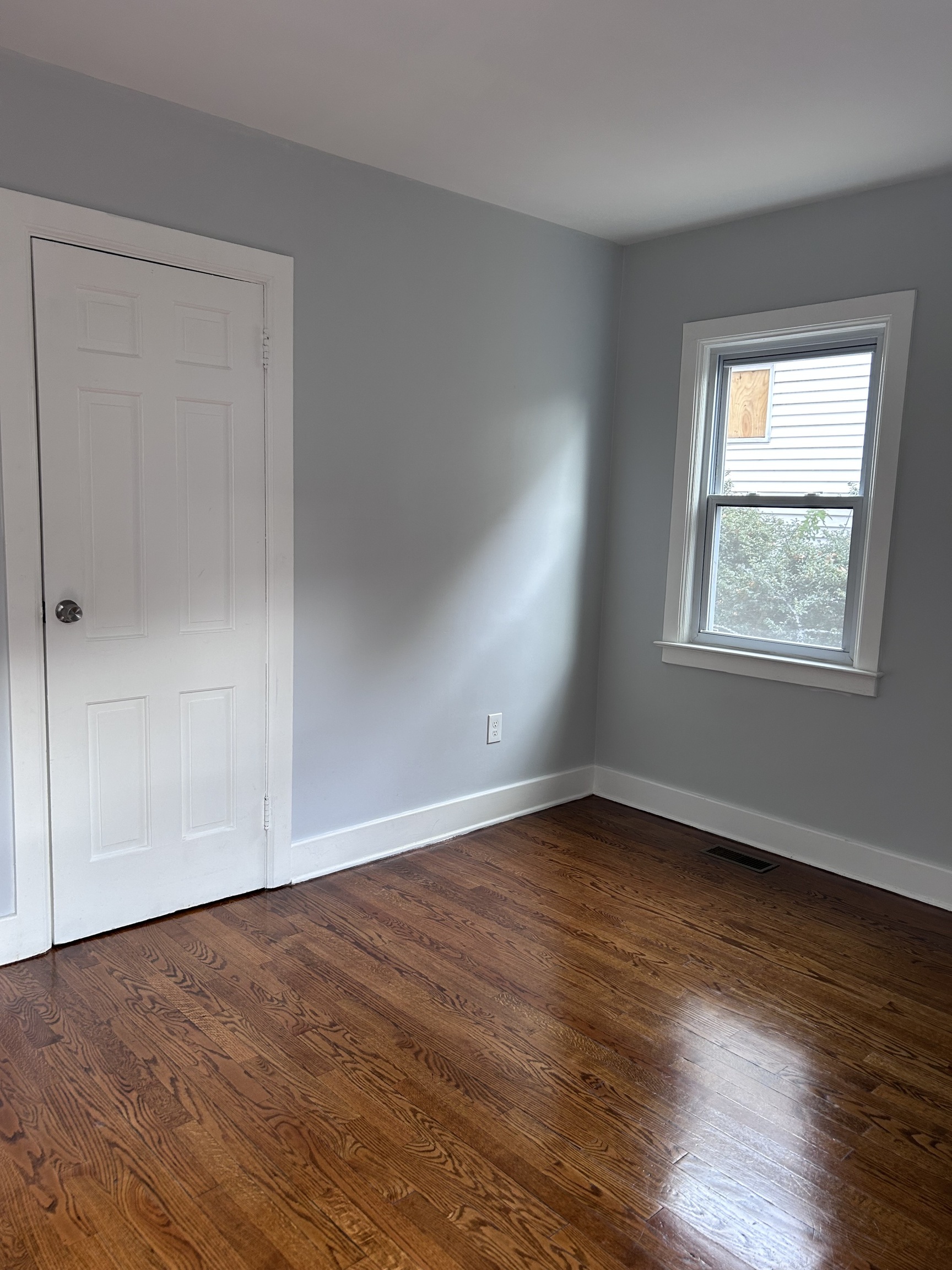 36 Forest Hills Road West Haven, CT 06516 - Photo 12 of 22 a view of an empty room with wooden floor and a window