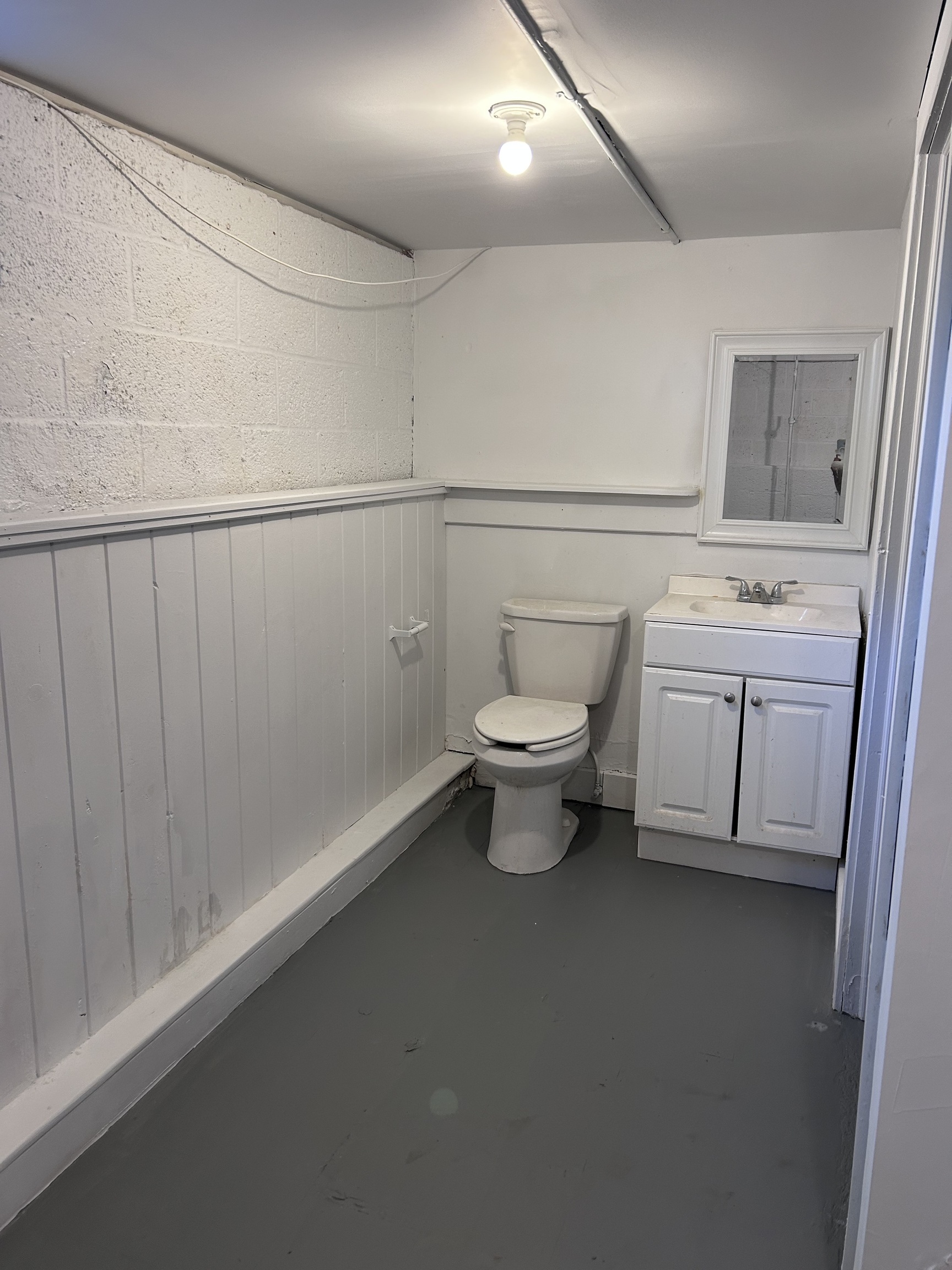 36 Forest Hills Road West Haven, CT 06516 - Photo 18 of 22 a bathroom with a toilet sink a mirror and vanity