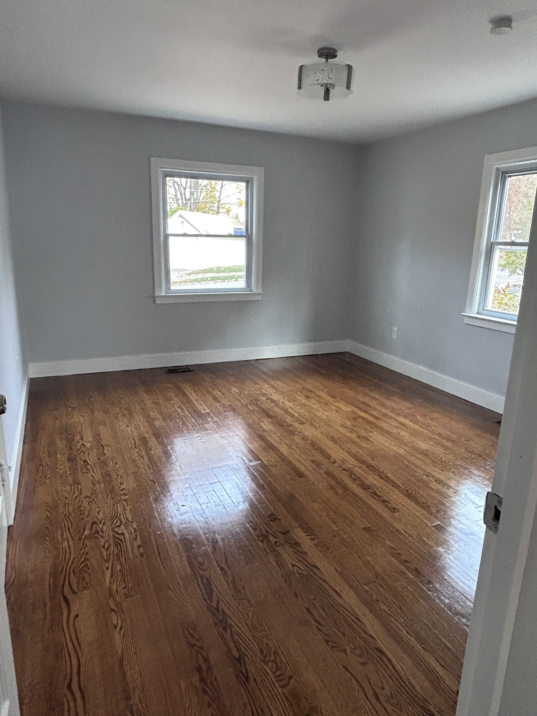 36 Forest Hills Road West Haven, CT 06516 - Photo 10 of 22 wooden floor in an empty room with a window