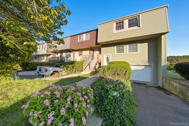 a view of a house with a garden