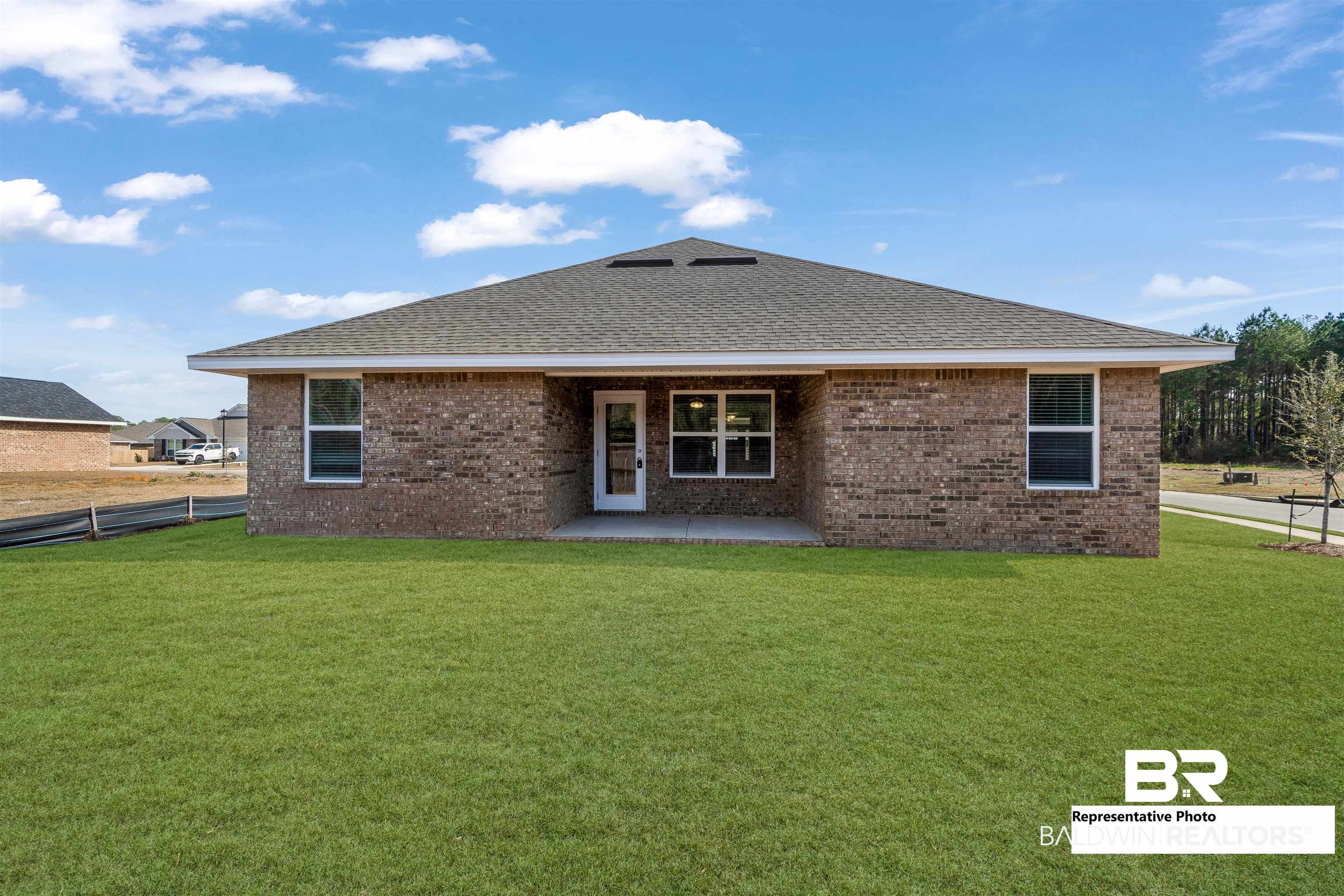 643 Mayflower Drive Foley, AL 36535 - Photo 32 of 34 Rear view of property with a yard, brick siding, and roof with shingles