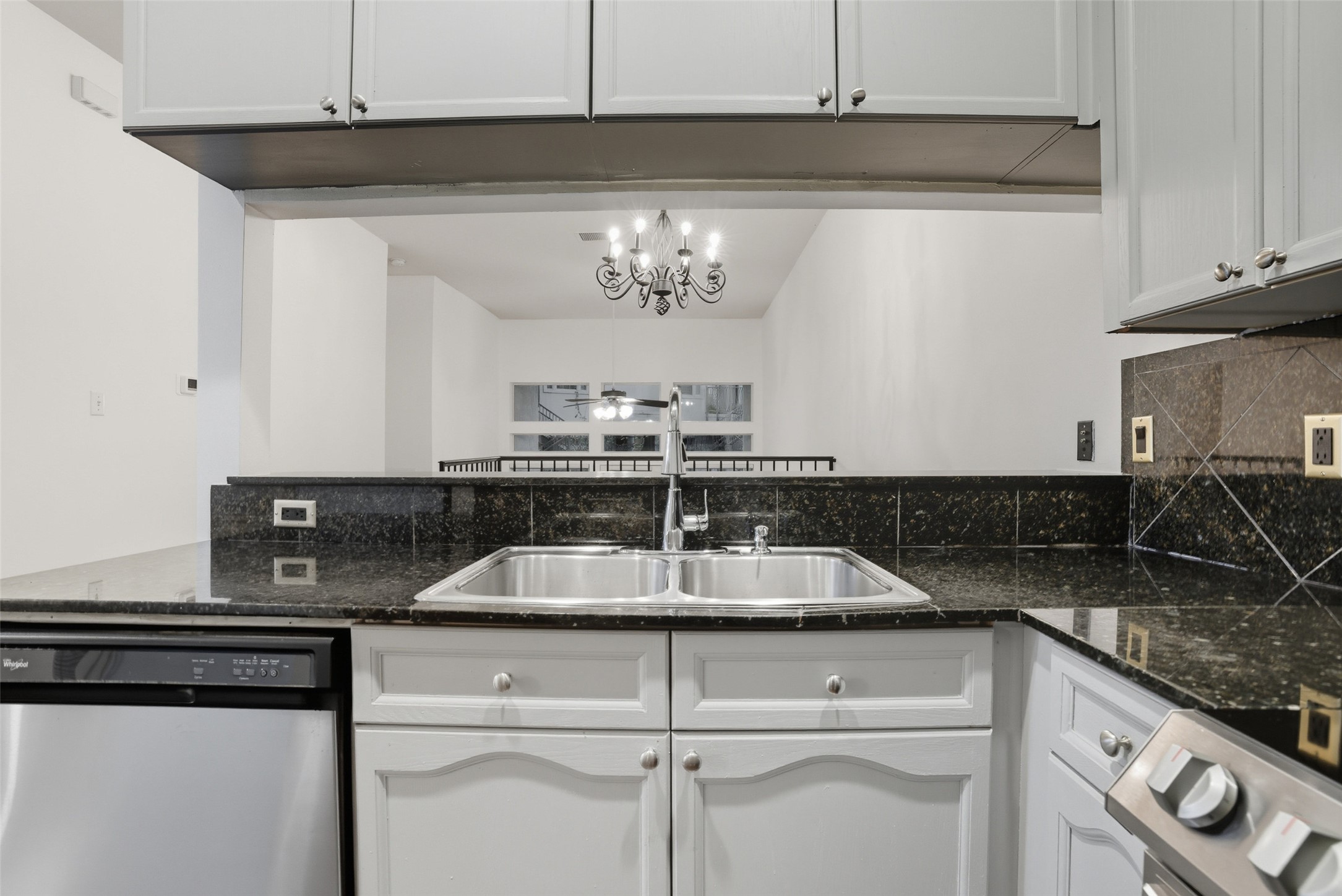 2918 Ranch To Market Road 620, Unit V267 Austin, TX 78734 - Photo 17 of 40 The kitchen has granite countertops, stainless steel appliances including refrigerator, electric stove and overlooks the dining room.