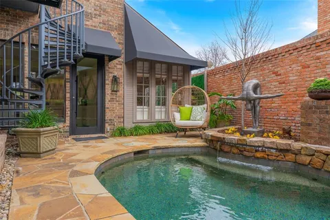 a view of swimming pool with outdoor seating