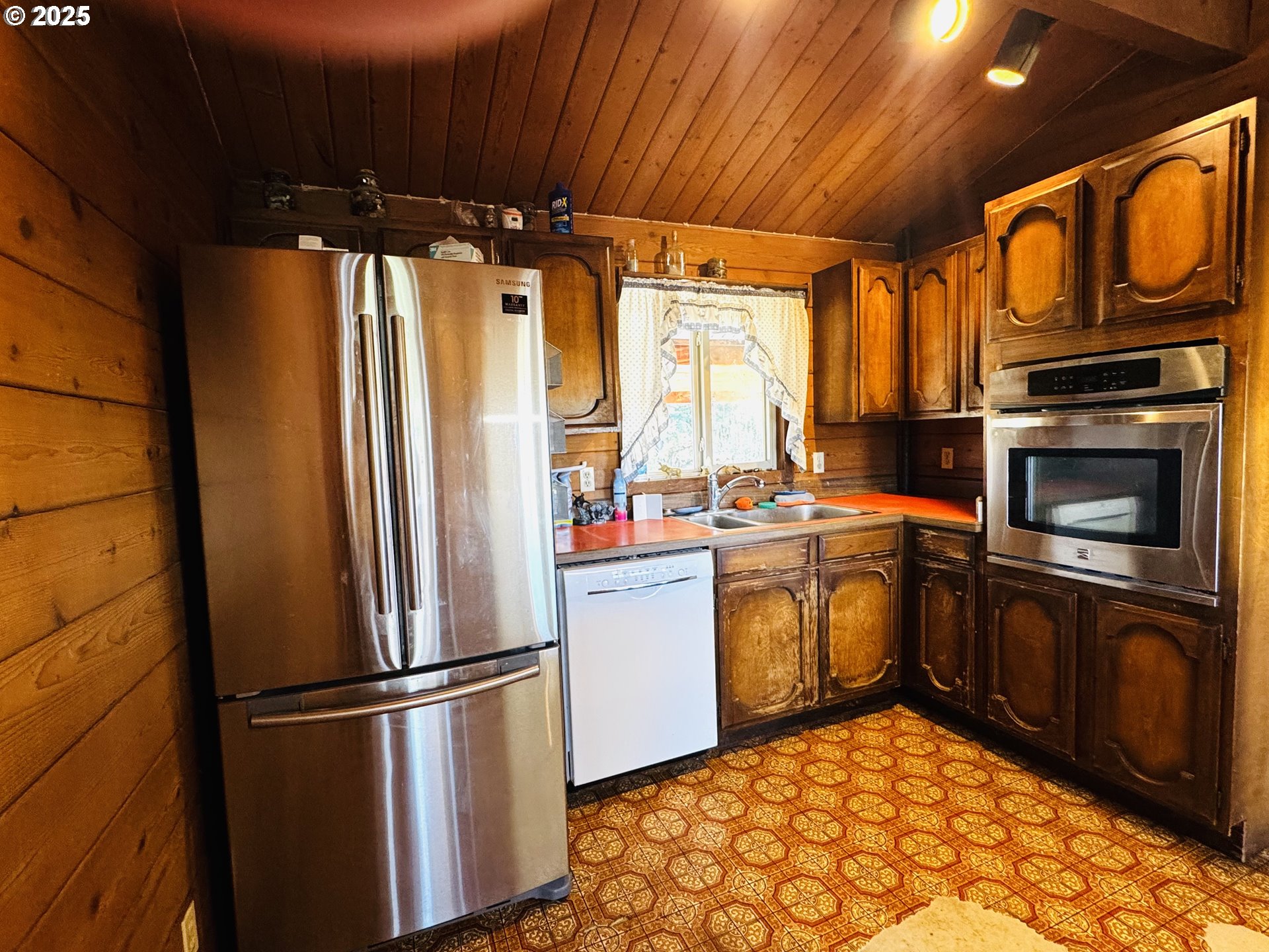 44 North Harris Road Goldendale, WA 98620 - Photo 11 of 36 a kitchen with a refrigerator sink and stove