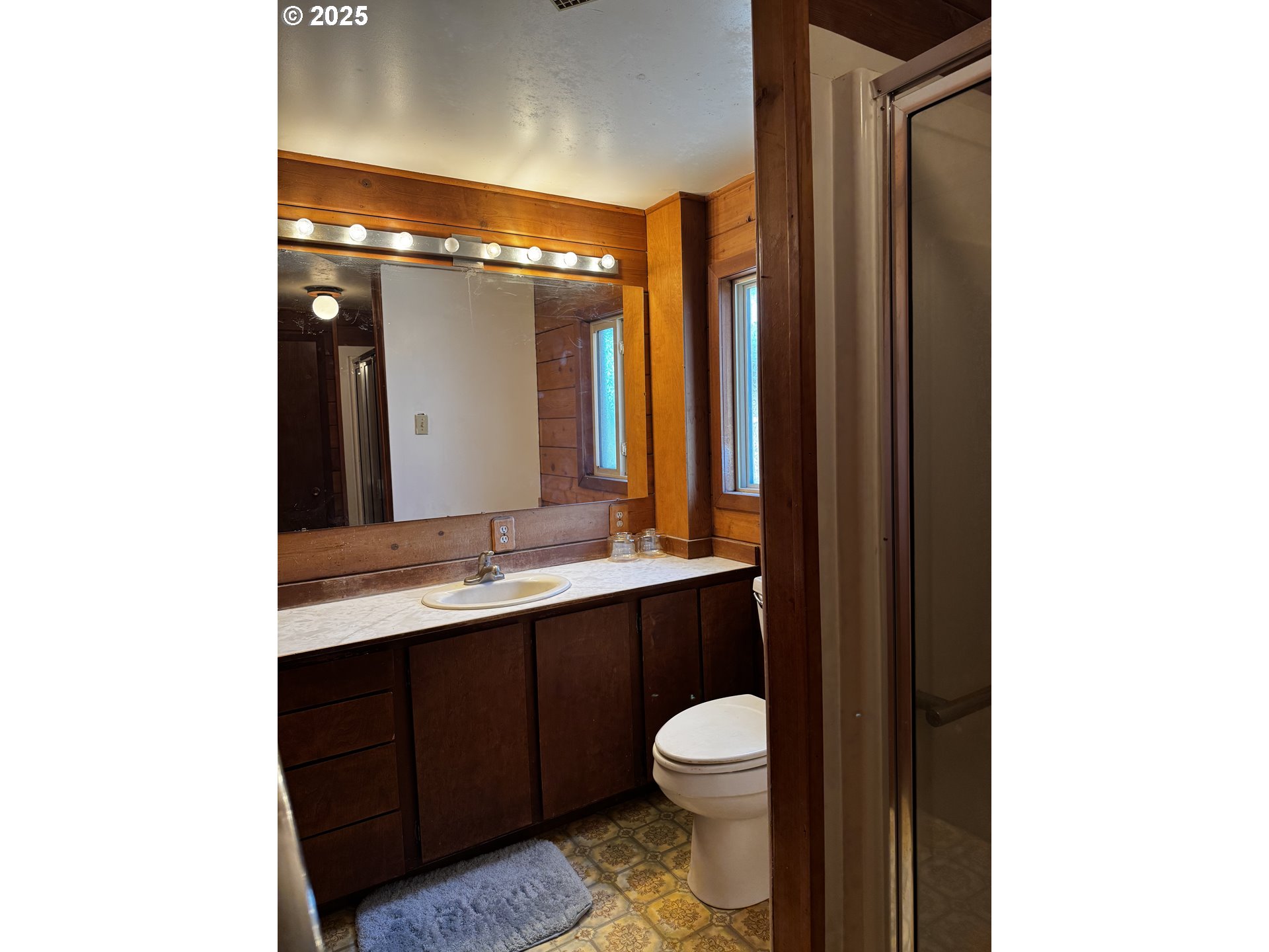 44 North Harris Road Goldendale, WA 98620 - Photo 14 of 36 a bathroom with a sink a toilet a mirror and shower