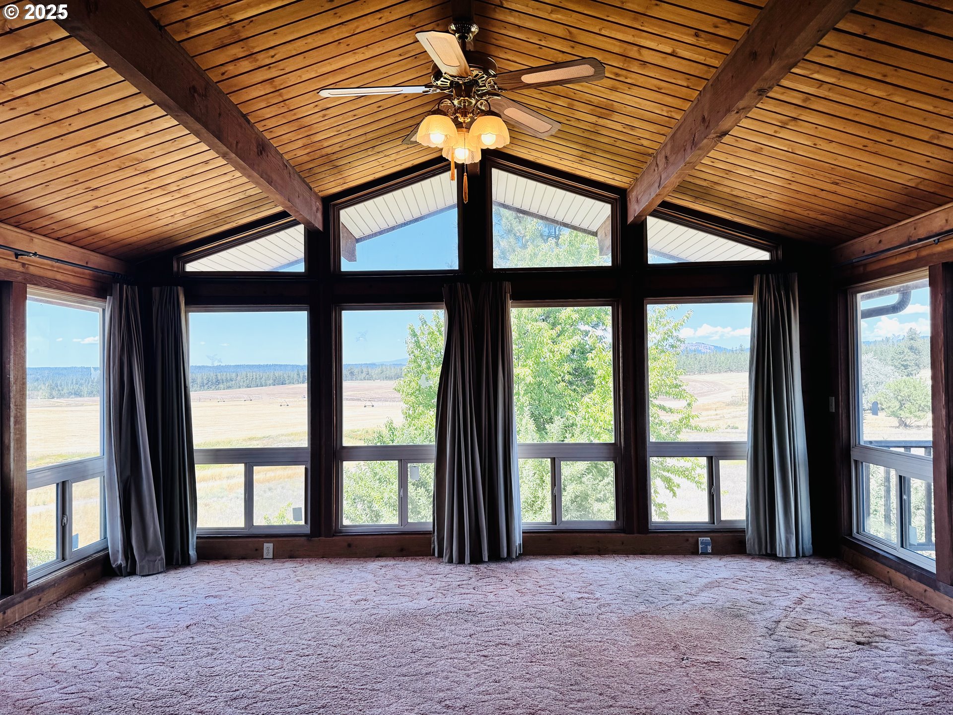 44 North Harris Road Goldendale, WA 98620 - Photo 7 of 36 a view of an empty room with a balcony