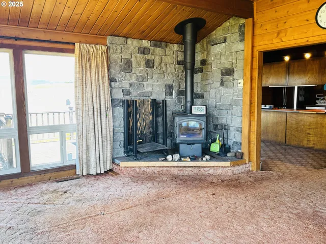 a view of a hallway with brick wall and potted plants