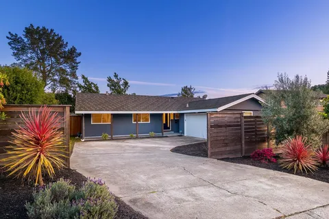 front view of a house with a yard