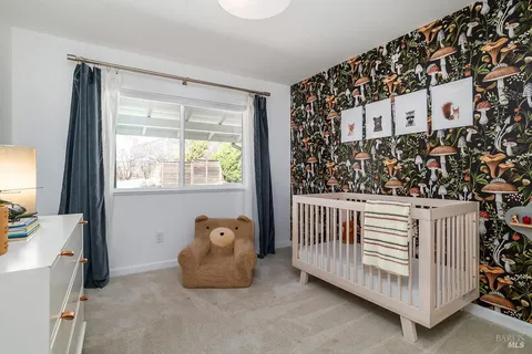 a room with a large window and a couch