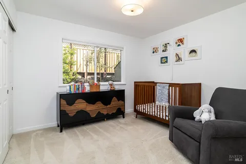 a bed room with furniture and a window