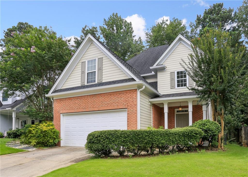 2991 Rosebrook Drive Decatur, GA 30033 - Photo 1 of 1 a front view of a house with a yard and garage