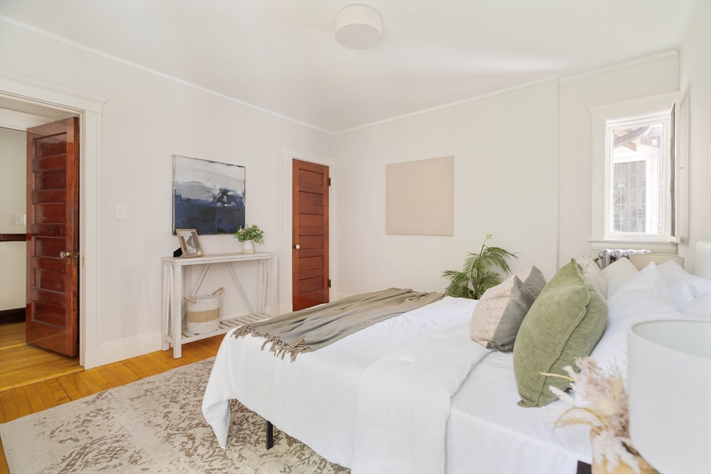 2 Clinton Street, Unit 37 Cambridge, MA 02139 - Photo 15 of 23 a bedroom with a bed and a dresser