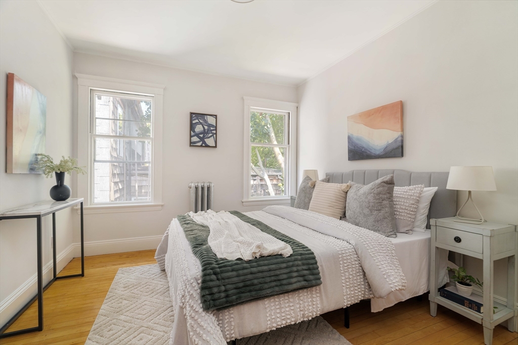 2 Clinton Street, Unit 37 Cambridge, MA 02139 - Photo 16 of 23 a bedroom with a large bed and a window