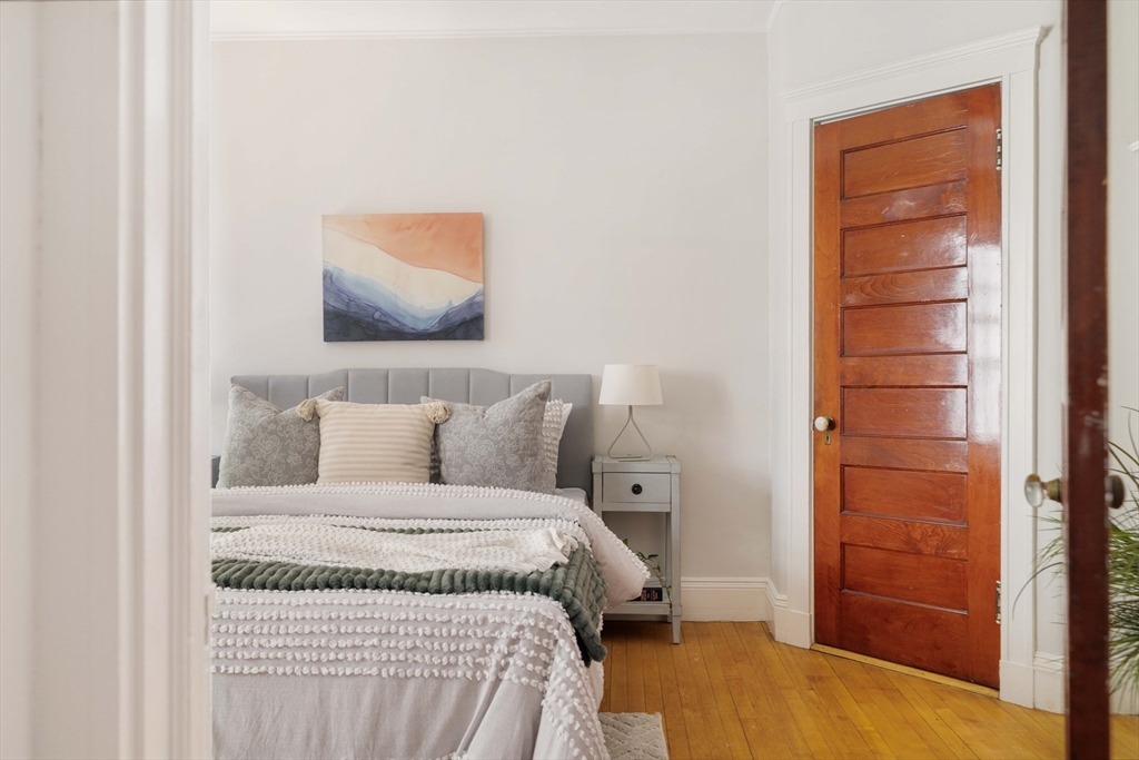 2 Clinton Street, Unit 37 Cambridge, MA 02139 - Photo 17 of 23 a bedroom with a bed and a cabinets
