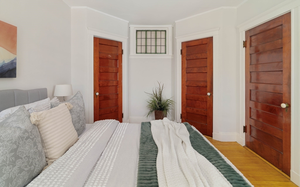 2 Clinton Street, Unit 37 Cambridge, MA 02139 - Photo 18 of 23 a bedroom with a bed and a dresser